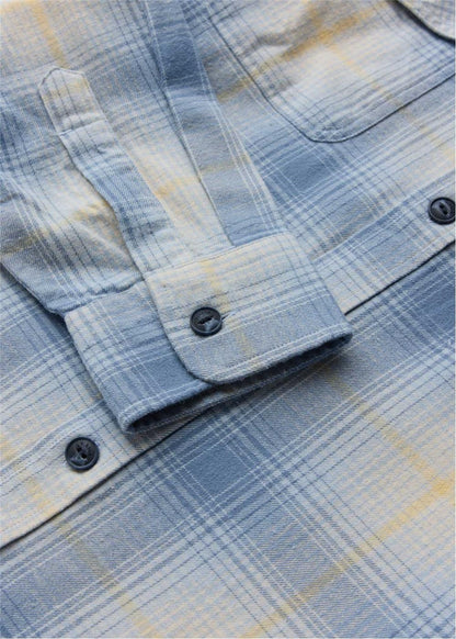 Vissla Central Coast Eco flannel shirt in blue organic cotton with a fine plaid pattern, chest pocket and dark buttons.