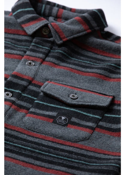 Vissla West Coast Overshirt in grey wool-blend fabric, with charcoal, red and teal stripes, button closure and chest pocket.