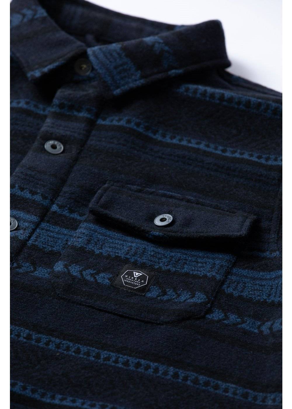 Vissla West Coast Overshirt in dark navy and blue patterned woven fabric, with a button front and flap chest pocket.