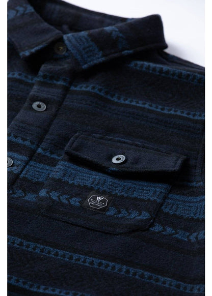 Vissla West Coast Overshirt in dark navy and blue patterned woven fabric, with a button front and flap chest pocket.