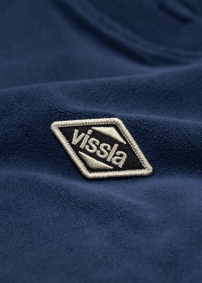 Fleece crewneck with navy blue textured fabric and a cream-edged Vissla chest patch, Vissla Swell Stretch
