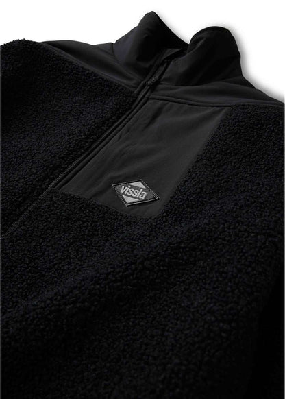 Vissla Kenny Pile Eco Jacket in black textured fleece with smooth contrast panels, a zip front and chest logo patch.