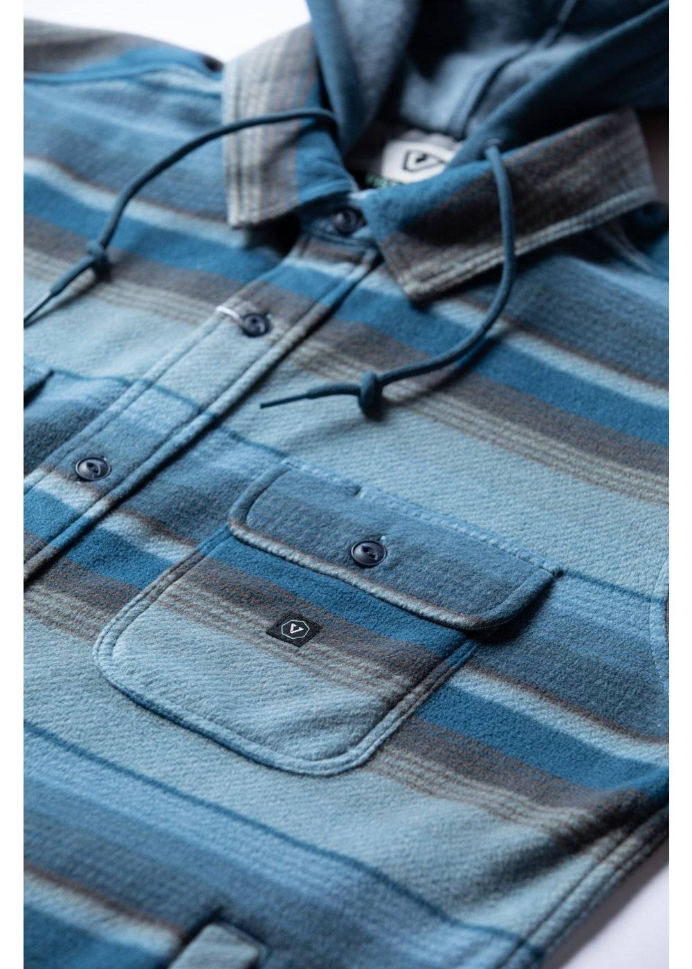 Vissla Eco-Zy Shirt Jacket in blue and gray striped fleece, with a hood, button front, and flap chest pocket.