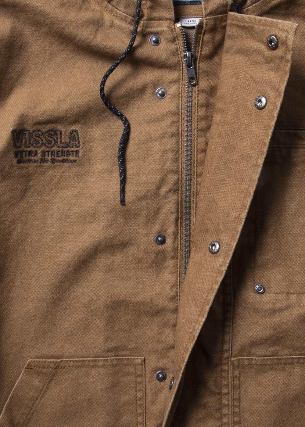 Vissla Creators Grit Jacket in brown cotton canvas, featuring a zip front, metal snaps, black logo embroidery and welt pockets.