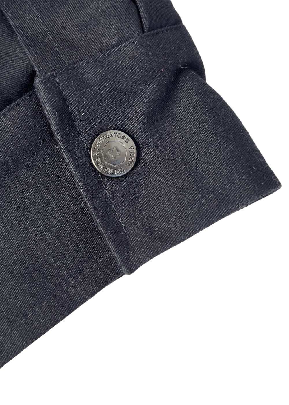 Vissla Creators Eco Port Jacket in dark charcoal stretch twill, with a buttoned cuff tab and engraved metal button.