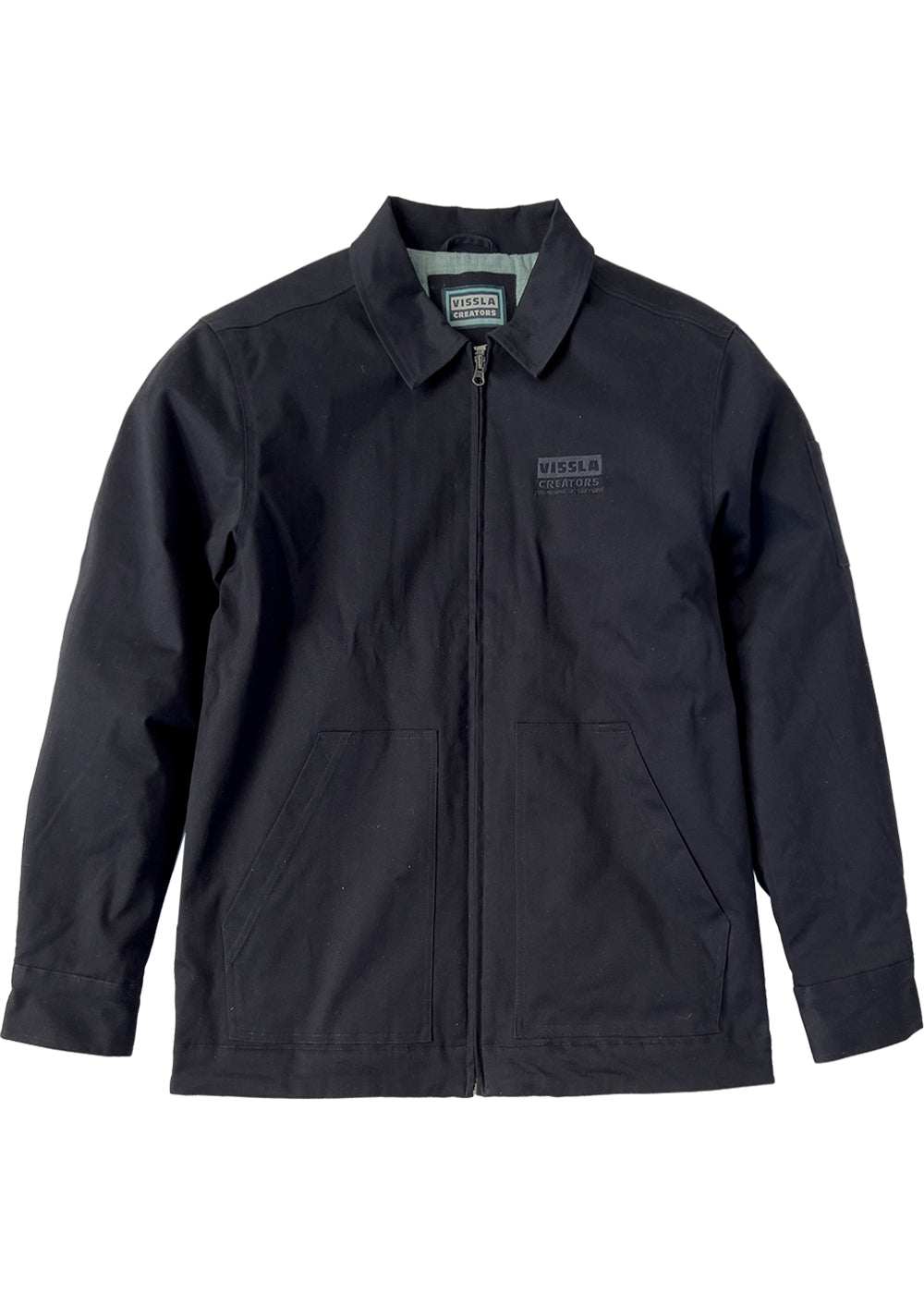 Vissla Creators Eco Port Jacket in dark navy cotton-blend twill, with a zip front, collar, chest logo, and angled pockets.