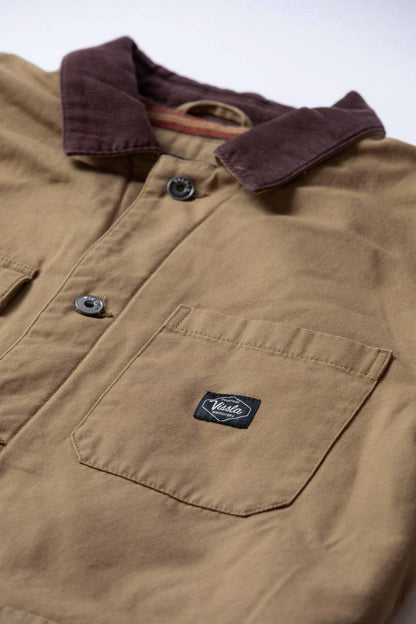 Vissla Peterson Jacket in tan cotton canvas with a dark brown corduroy collar, button front, and large chest pocket.