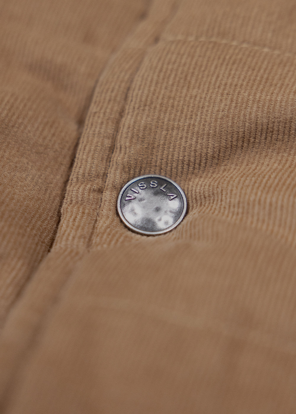 Vissla Paxon Jacket in tan corduroy, featuring fine ridged texture and a small round branded metal button.