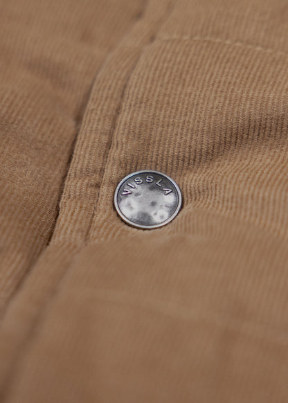 Vissla Paxon Jacket in tan corduroy, featuring fine ridged texture and a small round branded metal button.