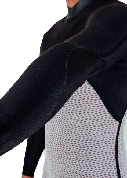 Vissla Natural Seas wetsuit with black sleeves and patterned white and purple torso, featuring full chest zip and contoured seams