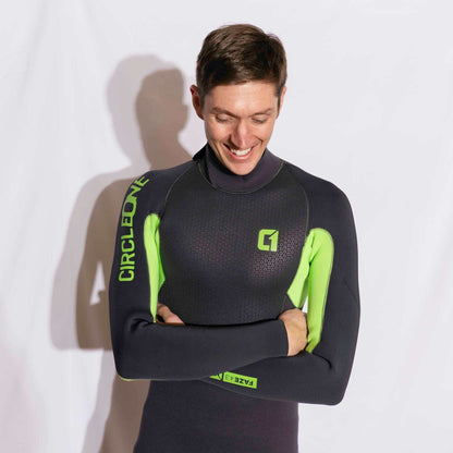Mens 4/3mm Spring Wetsuit in black neoprene with bright lime green panels, chest logo and sleeve branding.