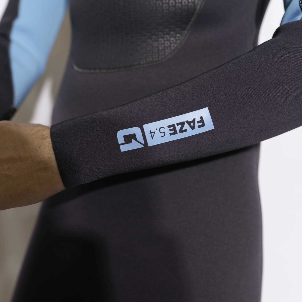 Mens 5/4mm Winter Wetsuit in black neoprene with a blue FAZE logo on the sleeve and textured chest panel.