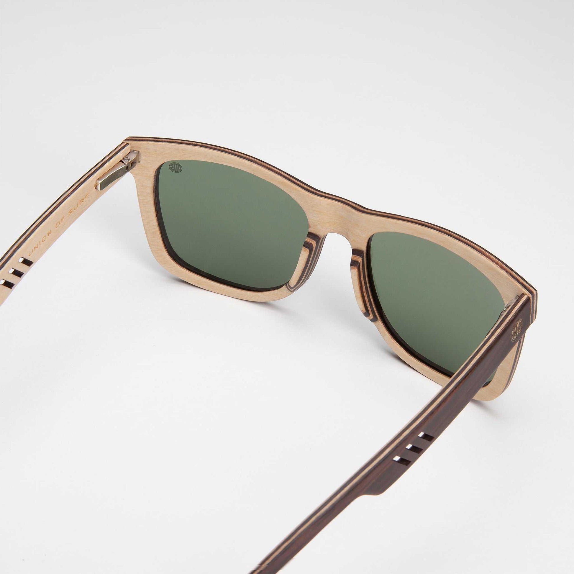 Sustainable wooden sunglasses with polarised green lenses, eco-friendly design for outdoor use
