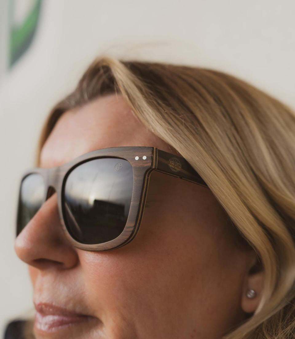 Pit Dog sunglasses with Ebony veneer wooden frame and G15 polarized green lenses for glare reduction and color enhancement.