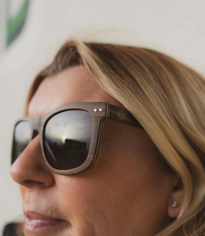 Pit Dog sunglasses with Ebony veneer wooden frame and G15 polarized green lenses for glare reduction and color enhancement.