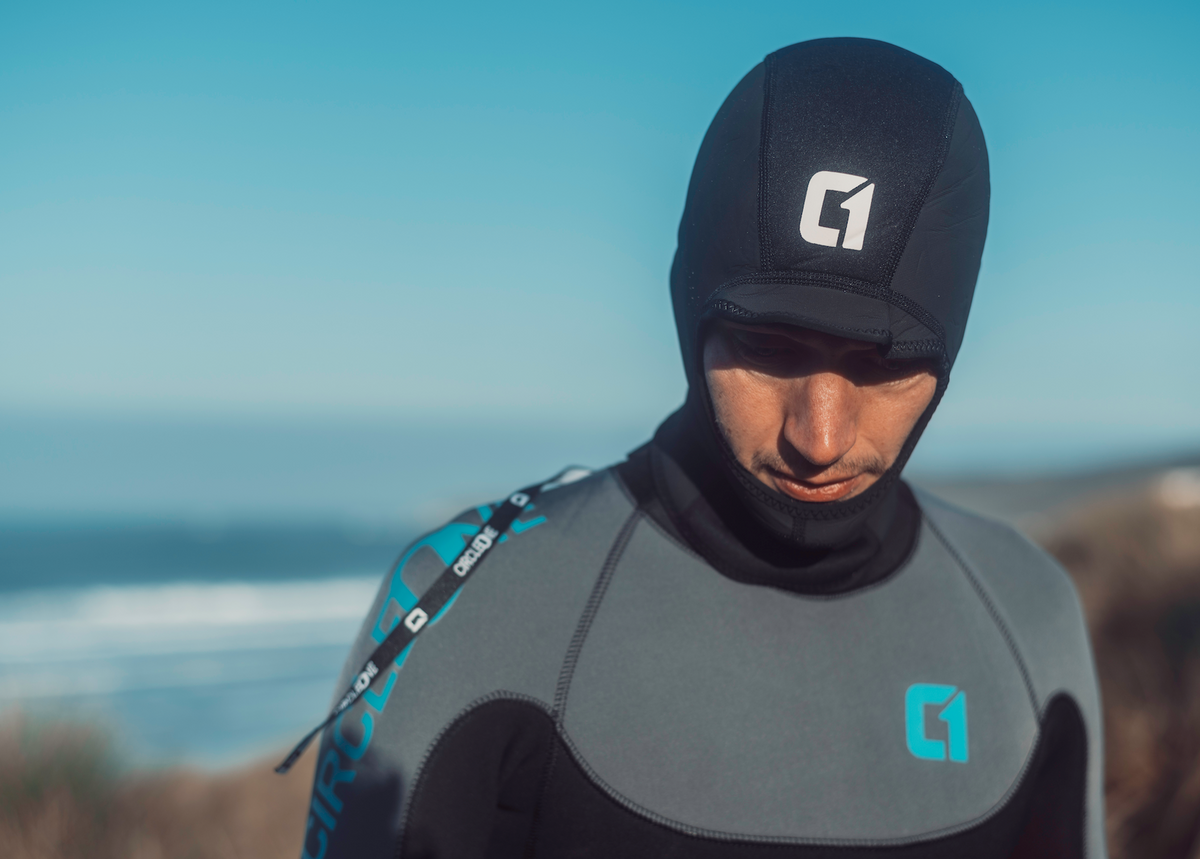 3mm ICON Wetsuit Hood in black neoprene, with a raised peak, extended neck gator and white logo.