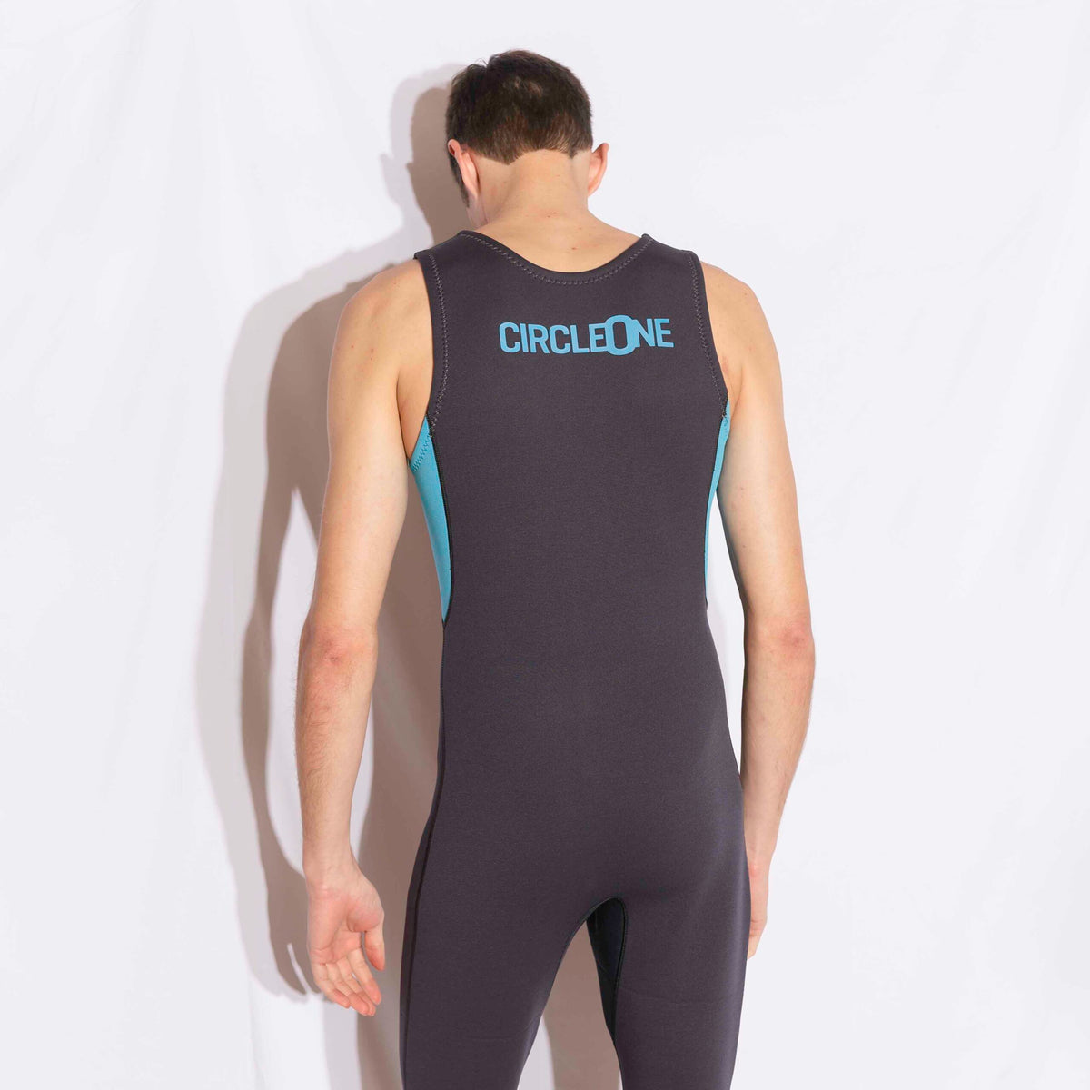 Mens 3/2mm LONG JOHN wetsuit in black stretch neoprene with blue side panels and Circle One branding on the back.