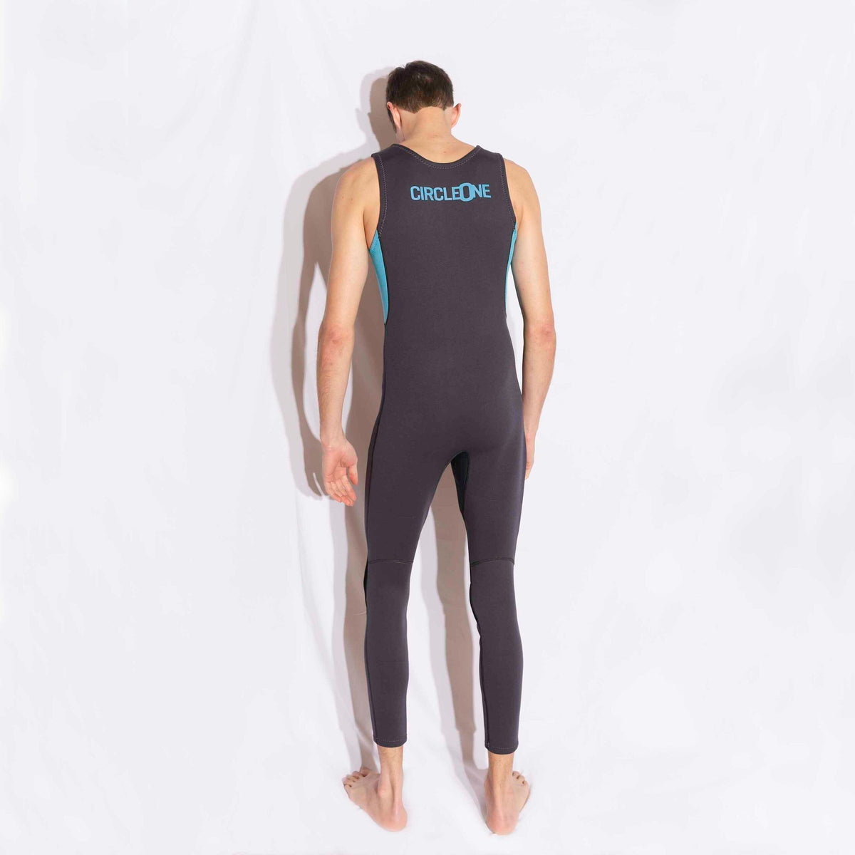 Mens 3/2mm LONG JOHN wetsuit in black stretch neoprene, sleeveless with turquoise trim and full-length legs.