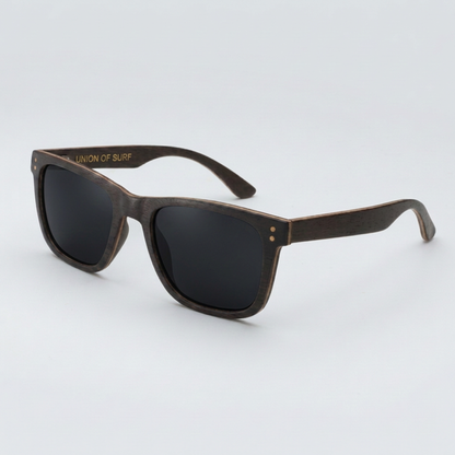 Fistral Black Wood sunglasses with sleek black wood frame and vibrant sky blue polarized lenses