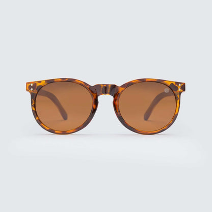 Mini Malibu circular sunglasses with pink camo frame, rose gold polarized lenses, and wooden arms