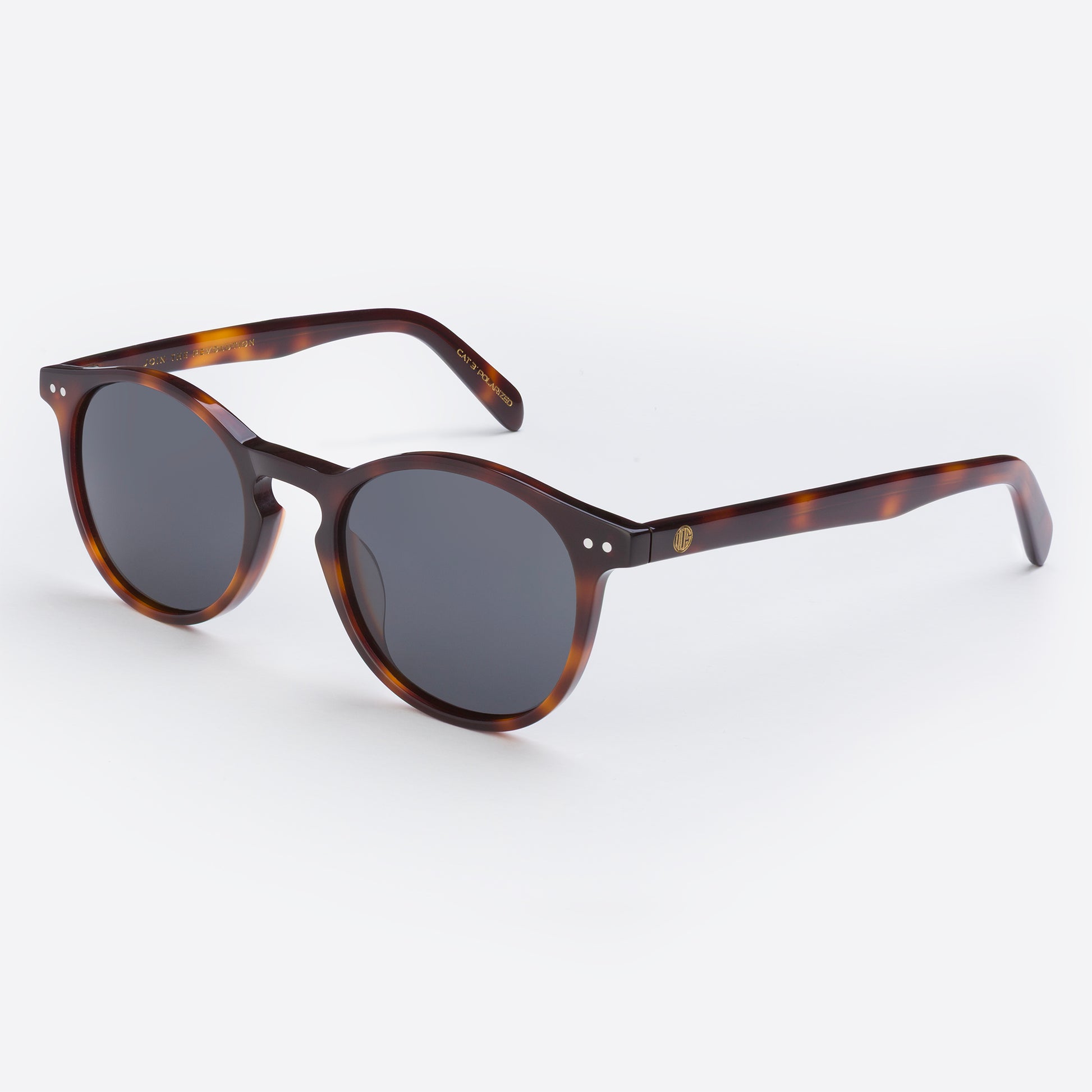 Sunglasses with tortoiseshell frame and dark lenses on a white background