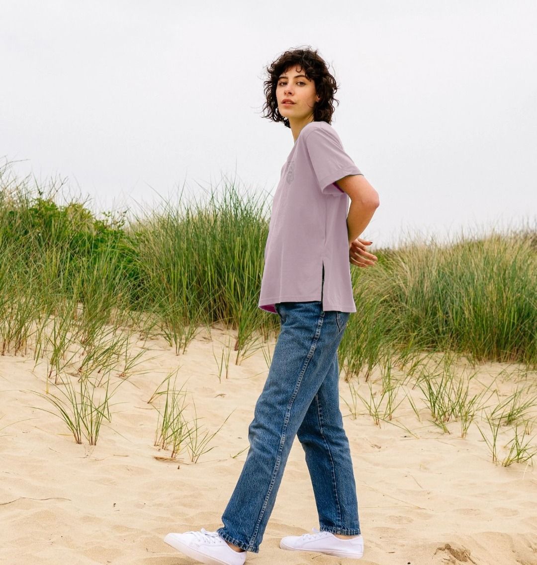 Woman wearing vibrant organic cotton graphic tee from Kooks on the Road collection