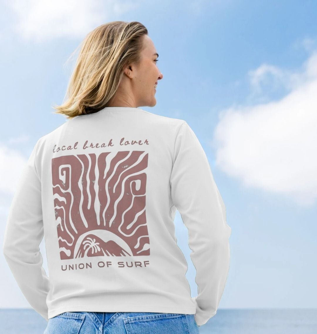 Woman wearing a Local Break Lover long sleeve graphic tee made from organic cotton