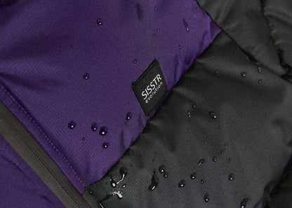 Sisstrevolution Rita Puff Jacket in purple and black, with smooth water-resistant fabric, quilted puff panels, and logo label.