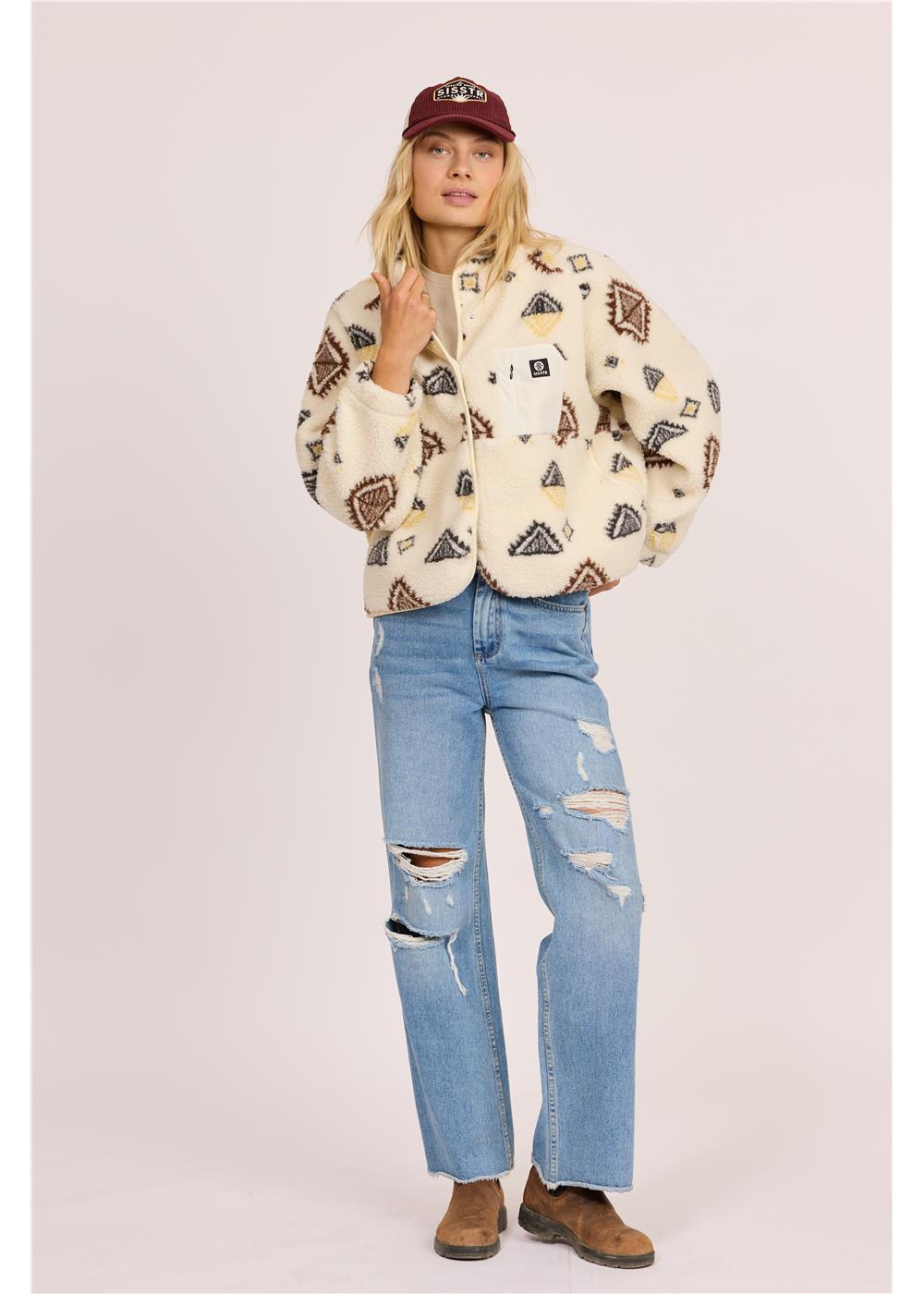 Sisstr Live Sherpa Fleece in cream sherpa fleece with brown geometric motifs, a snap-button front, chest pocket and side pockets.