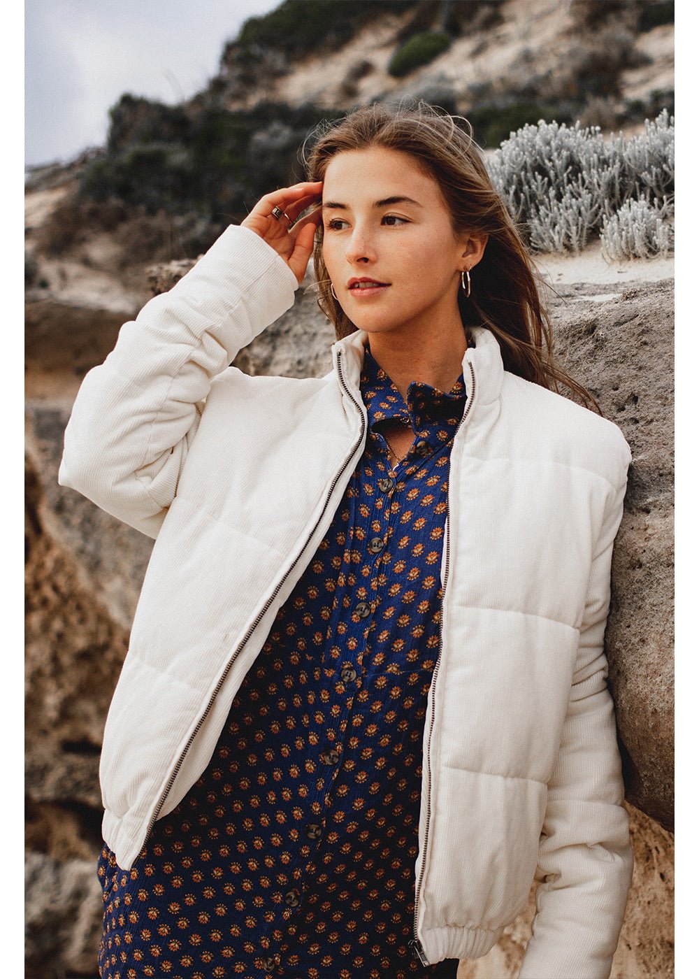 Sisstrevolution Bells Jacket, white quilted cotton puffer with a front zipper and stand collar.