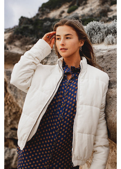 Sisstrevolution Bells Jacket, white quilted cotton puffer with a front zipper and stand collar.