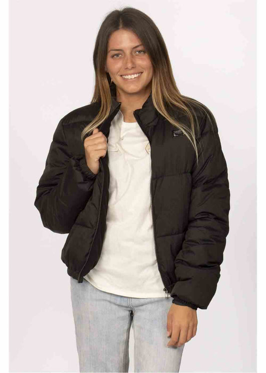 Sisstrevolution Chica Puffer Jacket in black quilted polyester, featuring a stand collar, zip front and elastic cuffs.