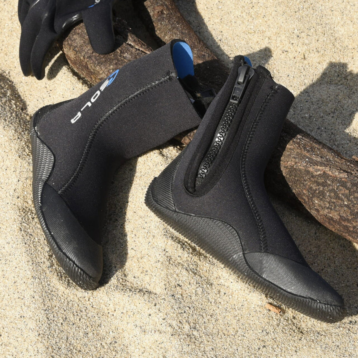 Sola 5mm Zip Boot wetsuit boots in black neoprene, with front zips, textured soles and reinforced toe and heel panels.