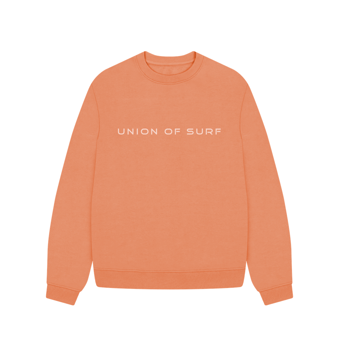 Peach-colored Union of Surf soft touch sweater with white chest text.