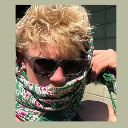 Man wearing Wave Hog polarised sunglasses and a green patterned bandana.
