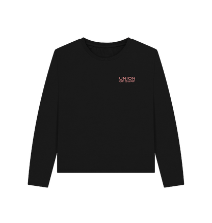 Woman wearing a Local Break Lover long sleeve graphic tee made from organic cotton